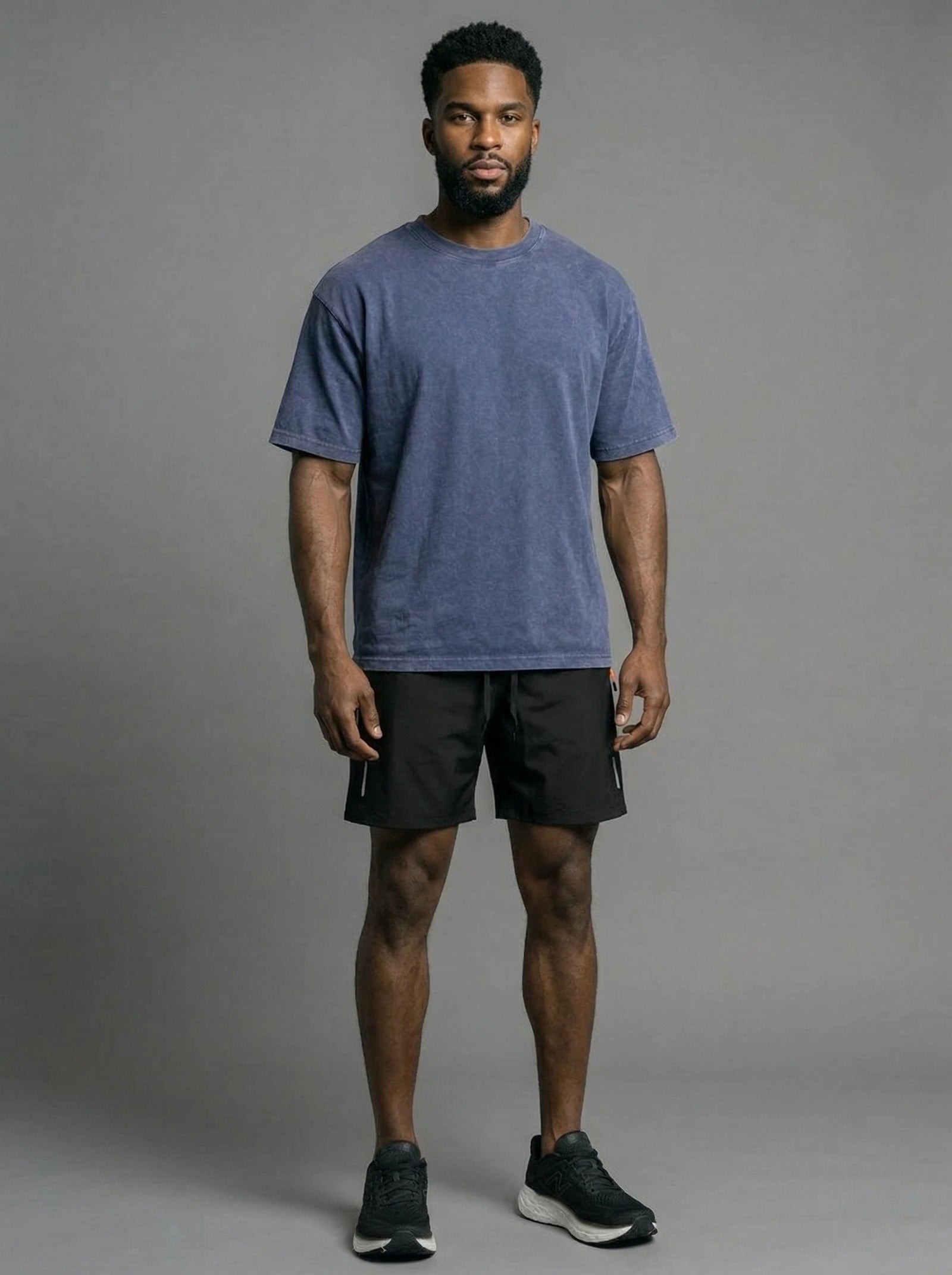 Model wearing the blue vintage oversized cotton shirt with black active shorts
