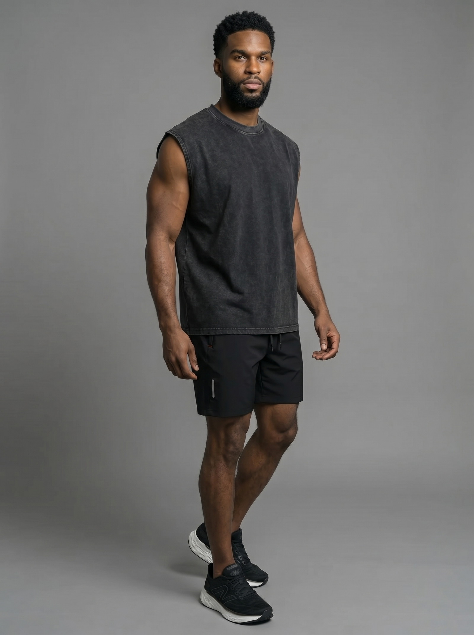 Model wearing the vintage oversized cotton tank with black active shorts