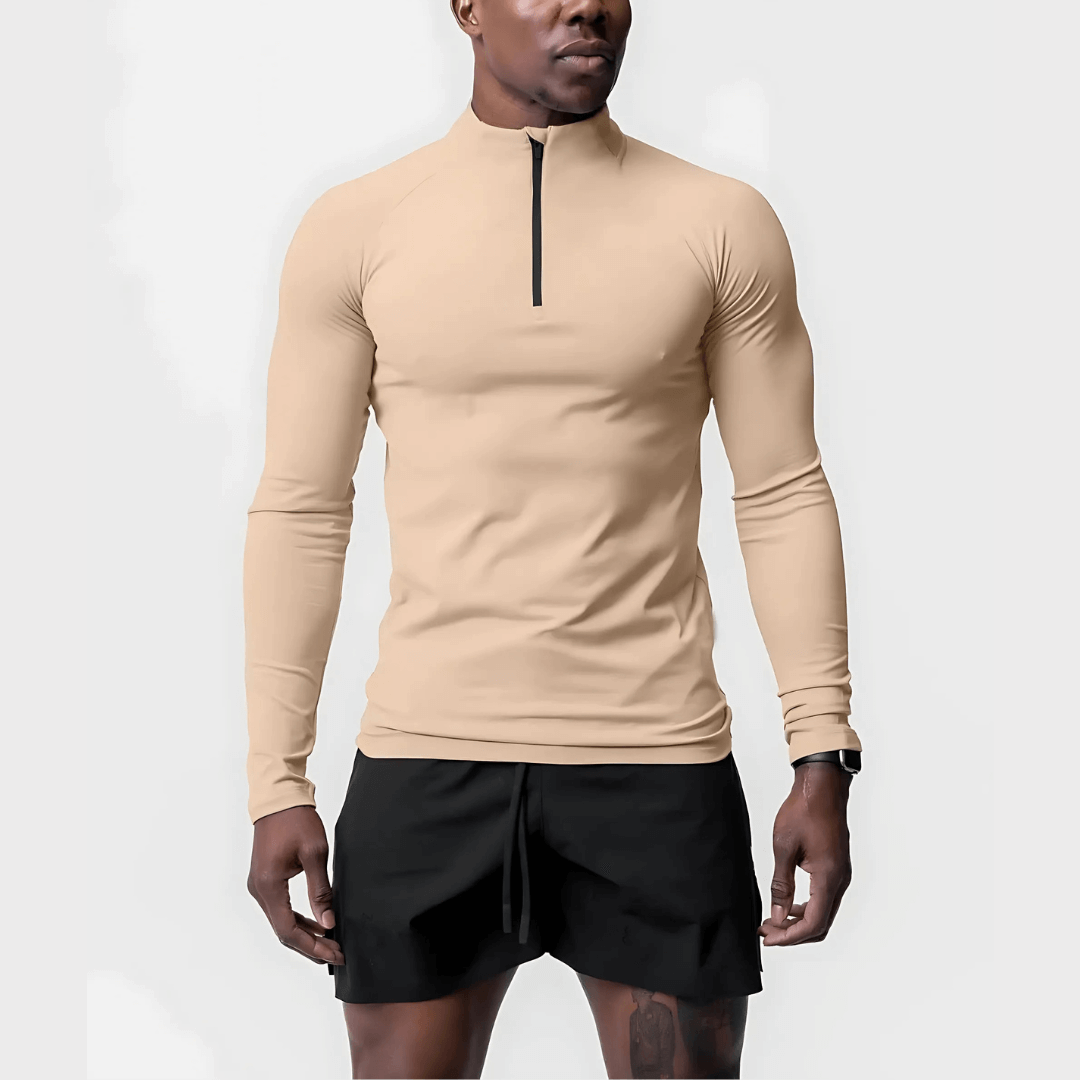 Men's Muscle V-Taper Quarter Zip performance top in beige, showcasing a sleek fit and modern design for athletic wear.