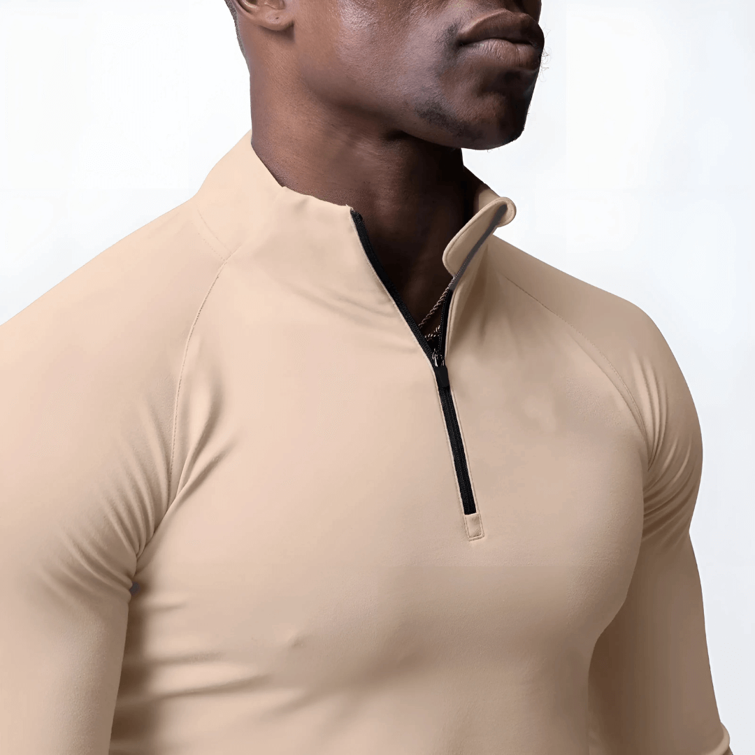 Men's Muscle V-Taper Quarter Zip top in beige, showcasing a sleek, fitted design for enhanced performance and physique.