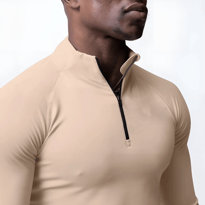 Men's Muscle V-Taper Quarter Zip top in beige, showcasing a sleek, fitted design for enhanced performance and physique.