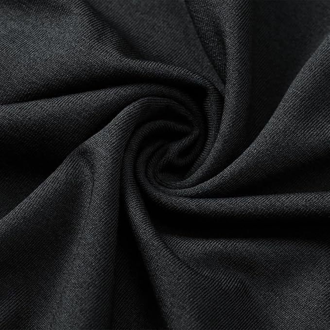 Close-up of black fabric showcasing its soft texture and stretch for performance wear.
