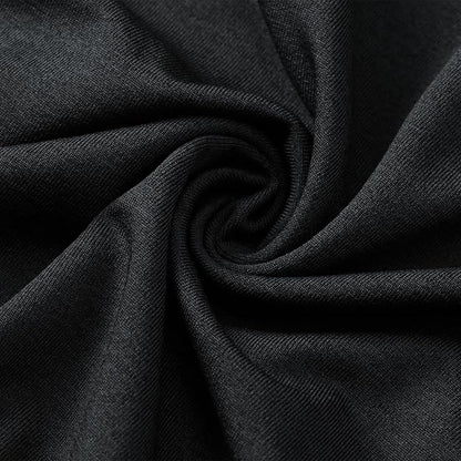 Close-up of black fabric showcasing its soft texture and stretch for performance wear.