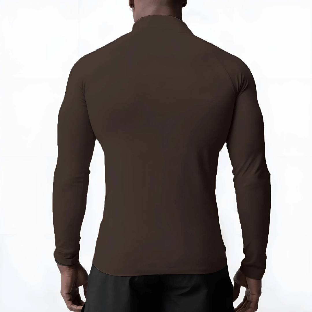 Back view of a man wearing a Muscle V-Taper Quarter Zip, showcasing the sleek fit and premium compression fabric.
