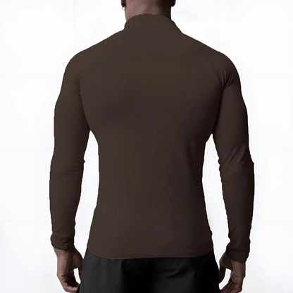 Back view of a man wearing a Muscle V-Taper Quarter Zip, showcasing the sleek fit and premium compression fabric.